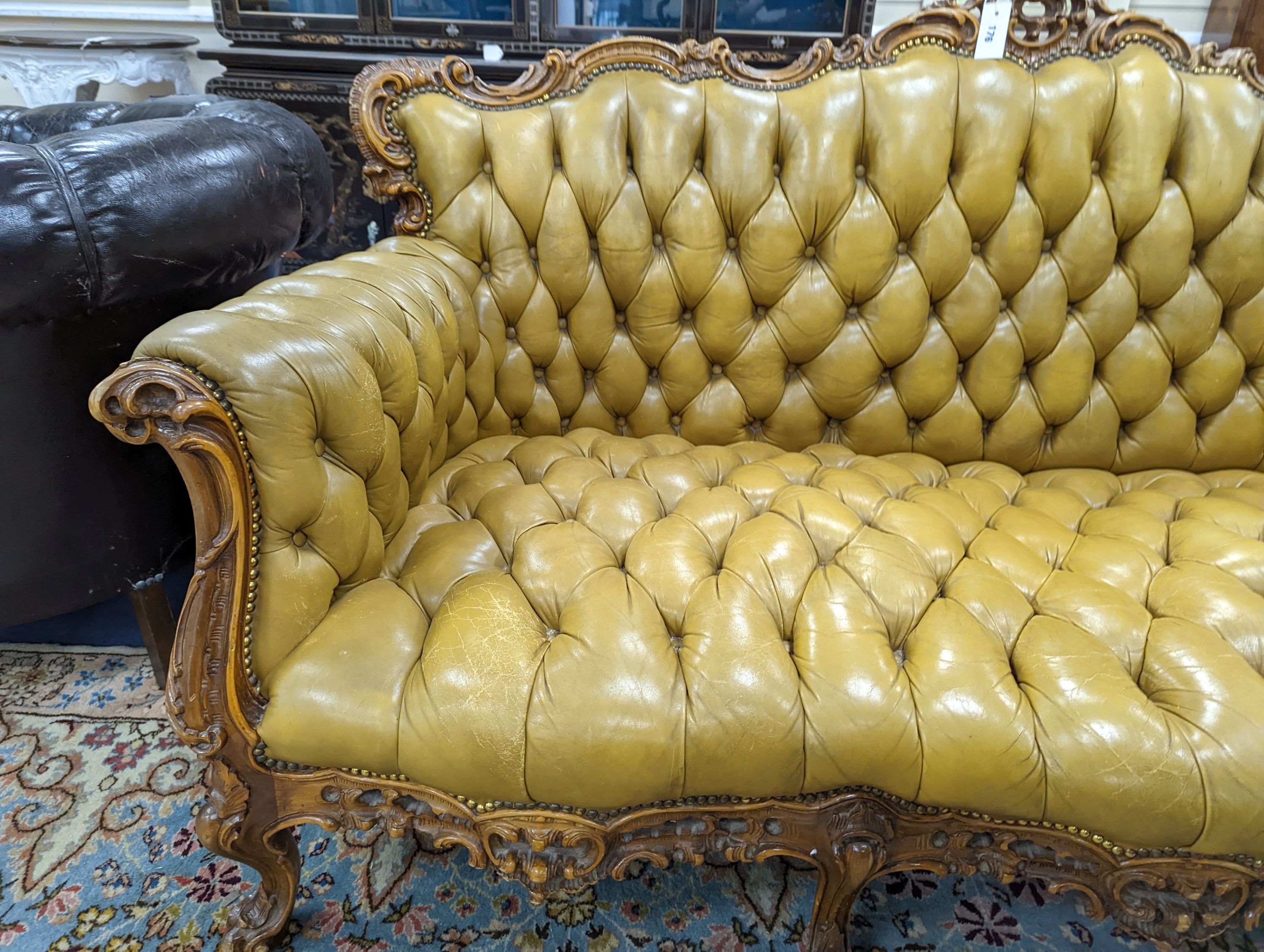 A Louis XVI design settee upholstered in buttoned olive leather, length 190cm, depth 70cm, height 99cm